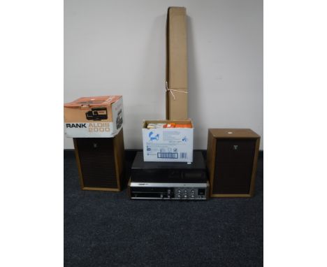 A Sanyo 4 channel stereo system with speakers and a box Aldis projector, screen and box of slides 