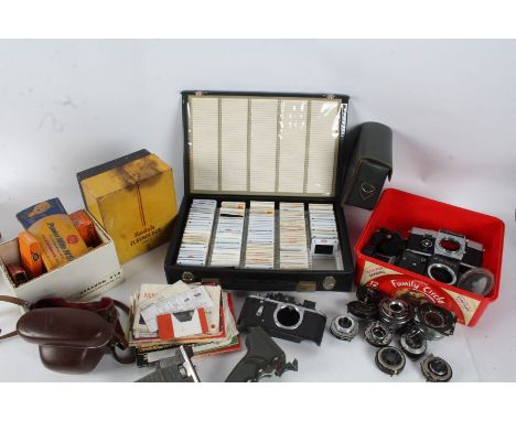 A large collection of various camera parts and accessory's to include Zenit TTL camera body and a Exakta RTL1000 camera body,
