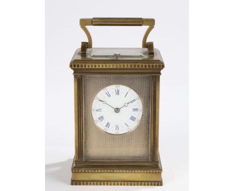 Late 19th Century French brass carriage clock, of large proportions, with a five bevelled glass case and a white enamel dial 