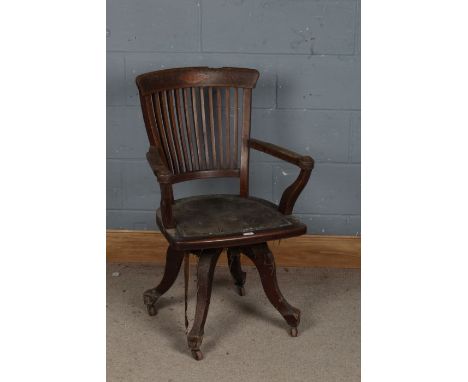 A 20th century mahogany desk chair, the top rail with boxwood inlaid and a inlaid diamond lozenge above multiple inlaid slats