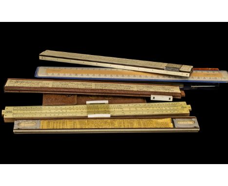 A Collection of Eight Vintage Sliding Calculating Rulers, various makers comprising  (2), Unique made in England, BP Shell, V