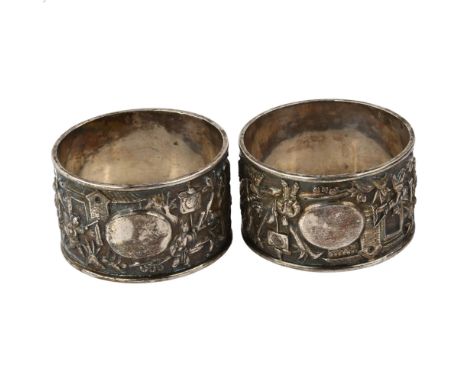 A pair of Chinese export silver napkin rings, circa 1900, relief embossed ceremonial decoration, diameter 5cm, 1.8ozNo damage