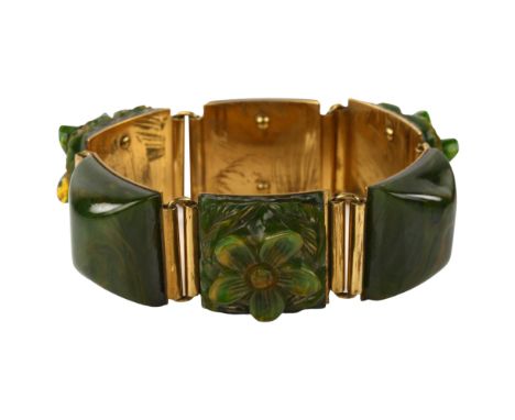 An Art Deco green Bakelite floral panel bracelet, length 17cm, 48.9gNo damage or repairs, no chips or cracks, fitting working