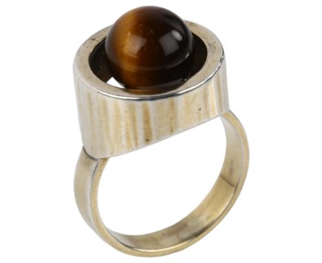 HANS HANSEN - a Danish modernist silver-gilt tigers eye ring, setting diameter 16.3mm, size O, 10gNo damage or repairs, gildi