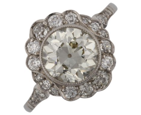 A fine Belle Epoque diamond cluster ring, unmarked white metal settings with collet set approx 1.98ct principal diamond, with