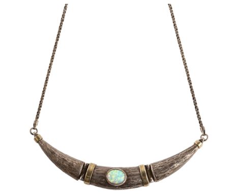 A modernist sterling silver and synthetic opal necklace, textured hinge design, necklace length 40cm, 18.3gNo damage or repai