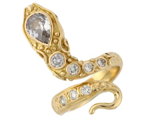 A fine 18ct gold diamond figural snake ring, closed back settings with chased foliate design, ruby eyes, pear-cut diamond hea