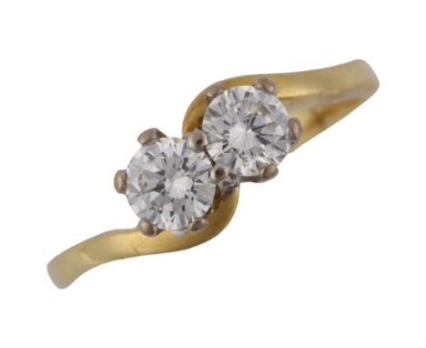 An 18ct gold two stone diamond crossover ring, set with modern round brilliant-cut diamonds, total diamond content approx 0.5