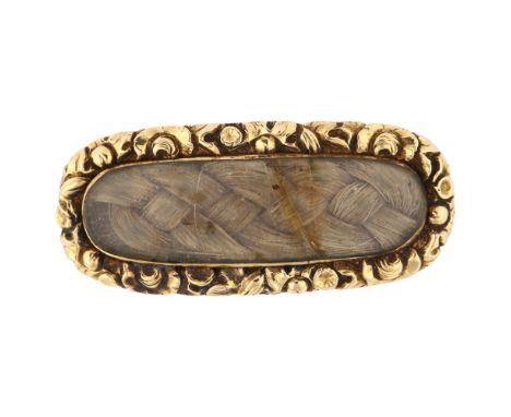 A 19th century mourning brooch, unmarked gold closed-back settings with woven hair panel beneath convex glass, brooch length 