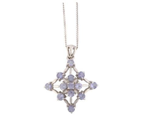 A modern 9ct white gold tanzanite spiderweb pendant necklace, on 9ct fine flat curb link chain, pendant height 24.9mm, chain 