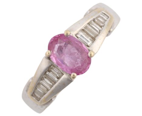 A modern 18ct white gold pink sapphire and diamond dress ring, set with oval mixed-cut pink sapphire and baguette-cut diamond