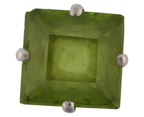 An 18ct white gold peridot dress ring, set with square scissor-cut peridot, setting height 16.2mm, size K, 4.2gPeridot has 2 