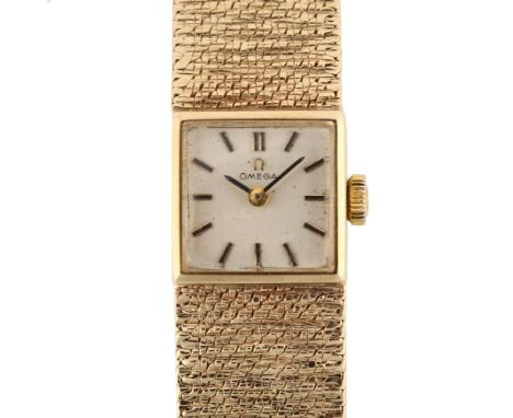 OMEGA - a lady's 9ct gold mechanical bracelet watch, circa 1968, silvered dial with baton hour markers and 9ct textured brace