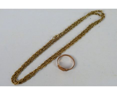 A rose gold ring (hallmarks very rubbed but presumed 9ct) and an unmarked yellow metal chain, 54 cm (l), approximately 7.7 gr