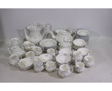 Royal Albert - A collection of tea wares in the Caroline pattern including teapot, coffee pot, cups, saucers, side plates and