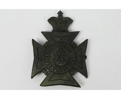 21st (Wigan) Lancashire Rifle Volunteer Corps Victorian helmet plate, blackened brass crowned Maltese cross, lions between th