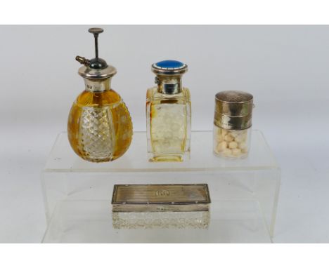 A group of silver mounted dressing table items comprising scent bottle with silver and enamel lid, Birmingham assay (date let