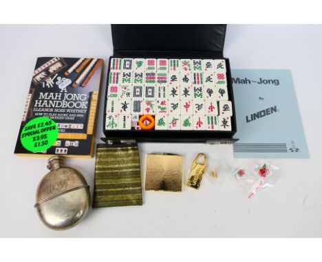 Lot to include a silver plated hip flask Mah Jong set, powder compact and other. [W]