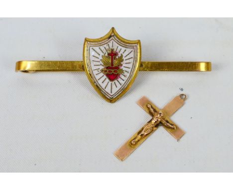 A yellow metal and enamel bar brooch, stamped 9ct and a crucifix pendant also stamped 9ct, approximately 5.8 grams. [W]