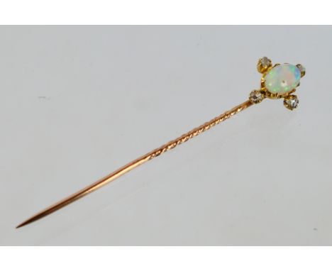 An Edwardian white opal and diamond stick pin contained in fitted case, 1.3 grams. [W]