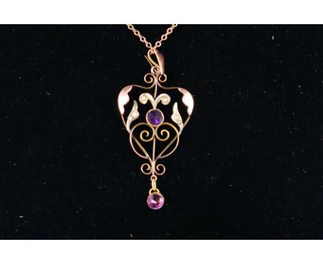 A Victorian rose metal pendant and chain (44 cm length), the pendant set with seed pearl and purple stones and stamped 9ct, a