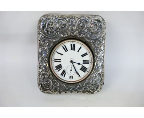 A nickel plated Goliath 8 day pocket watch, Roman numerals to a white enamel dial, subsidiary seconds dial, housed in a velve