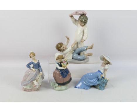 A collection of Lladro and Nao figures / groups, largest approximately 24 cm (h). [W]