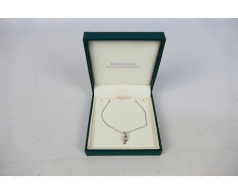 A 9ct white gold diamond set pendant on 9ct white gold chain (44 cm length), stated diamond weight 12 pts, 2.3 grams. [W]