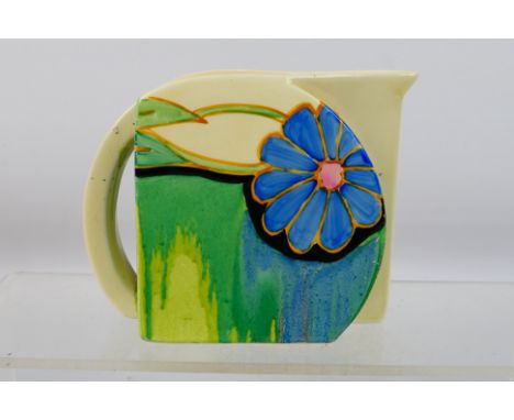 Clarice Cliff - A Clarice Cliff Bizzare floral hand painted jug. Appears to have multiple hairline cracks all around the jug,