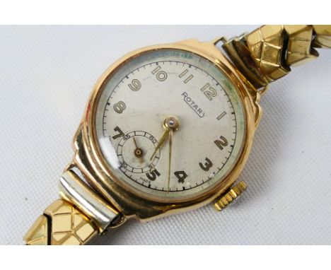 A lady's 9ct gold cased Rotary wrist watch, Arabic numbers and subsidiary seconds dial, on base metal expanding bracelet. [W]