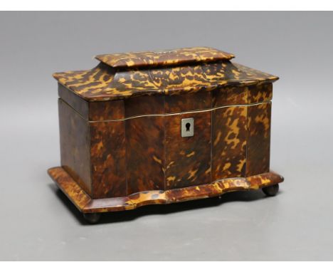 A 19th century tortoiseshell veneered tea caddy, ivory veneered edging, 20cms wide Ivory submission reference: MUM12DY8