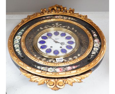 A floral painted clock, length 63cm, quartz movement