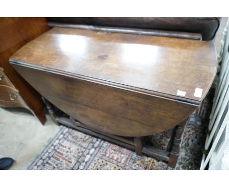 An 18th century oak gateleg dining table, length 141cm extended, width 120cm, height 74cm