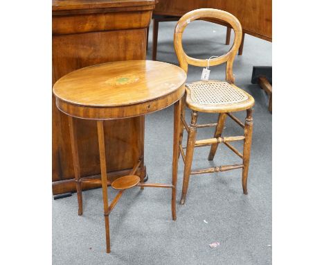 A Victorian caned beech child's correction chair and an Edwardian inlaid mahogany oval occasional table