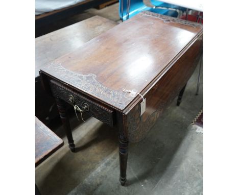 A Regency mahogany Pembroke table, later carved, width 89cms, depth 47cms, height 66cms.