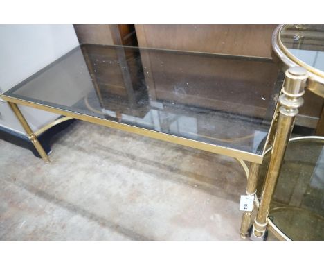 A brass and smoked glass rectangular coffee table, width 99cm, depth 51cm, height 42cm