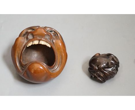 A Japanese mask nut carving wood carving, Meiji period and a netsuke of frogs, marks to bases, largest 7.5cm wide Ivory submi