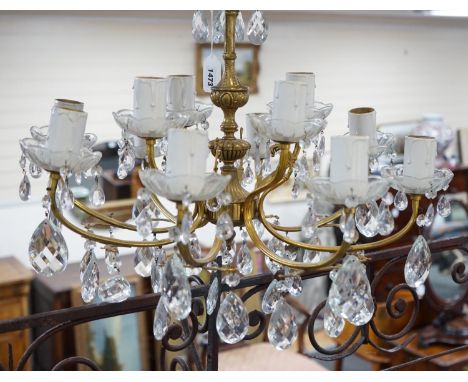 A cut glass eight branch twelve light chandelier, 39cms high