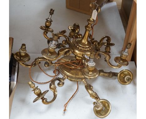 A brass two tier twelve light chandelier, 61cms high