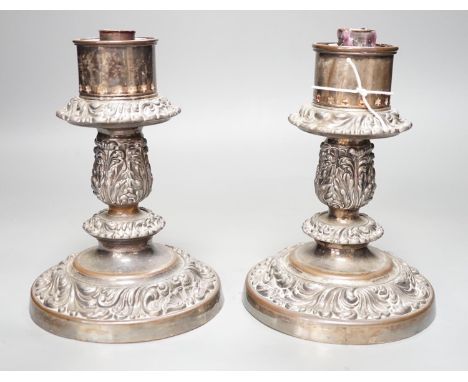 A pair of Victorian silver plated ships storm light candlesticks, glass funnels missing, 19cms high