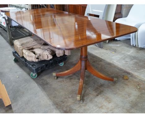 A reproduction Tillman style mahogany twin pillar extending dining table 246cms extended, two spare leaves, width 107cms, hei
