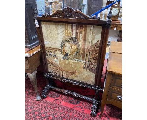 A Victorian rosewood firescreen inset polychrome tapestry panel, width 79cm, height 122cm