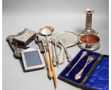 A group of small silver including two mounted photograph frames, one Birmingham, 1901, a mounted bible case, candlestick snuf
