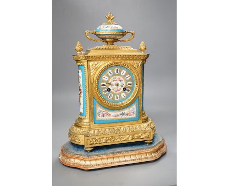 A French ormolu mantel clock, with inset floral decorated porcelain plaques and dial, 40cms high