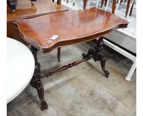 A Victorian mahogany stretcher table, length 106cm, depth 52cm, height 75cm