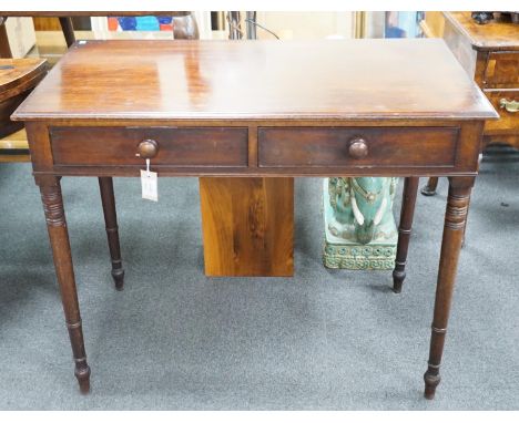 A Regency mahogany two drawer side table with moulded edge on turned legs, width 95cm, depth 51cm, height 78cm