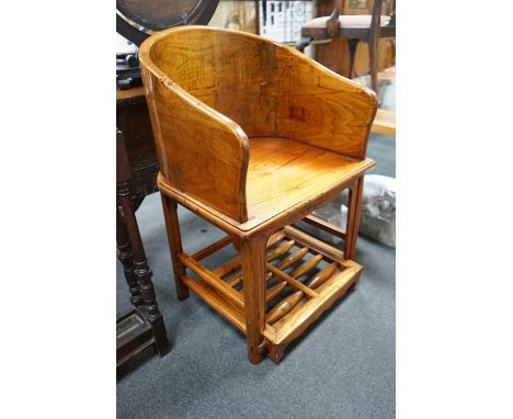 A pair of Chinese elm armchairs with roller footrests, width 57cm, depth 53cm, height 89cm