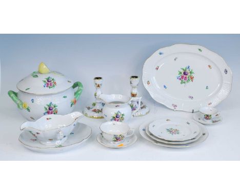 An extensive Herend porcelain dinner service, in the 'Printemps' pattern, decorated with flowers within a basketweave and gil