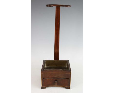 A mid-18th century Dutch walnut and inlaid long pipe-rack(?), having brass tray and base drawer, on later feet and with repai