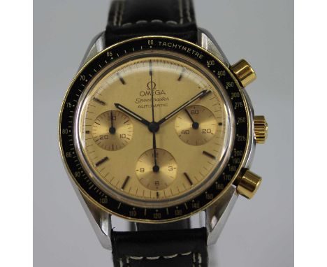 A gent's Omega Speedmaster automatic chronograph wristwatch, being steel cased, with gold plated crown and chronograph button